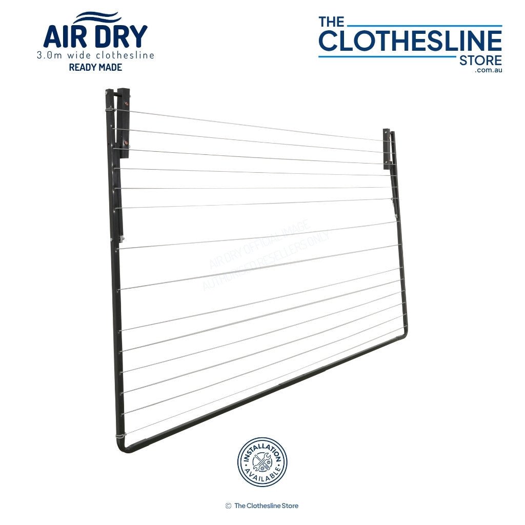 Air Dry Clothesline folded flat against a white wall.