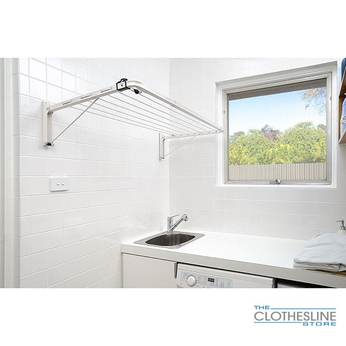 Austral Indoor Outdoor Clothesline In Location - above a sink in a laudnry room.